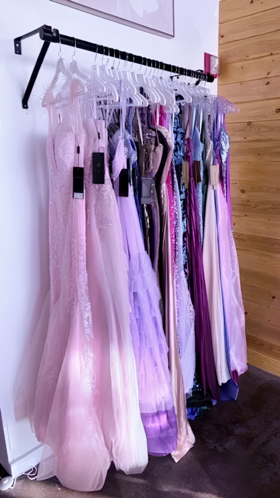 Colorful formal and special occasion dresses displayed at Nicole’s Boutique