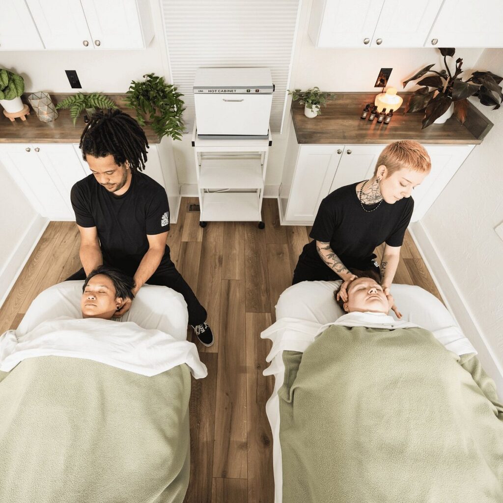 Guests enjoying relaxing massage treatments at Ballaura Spa